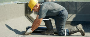 man fixing roof