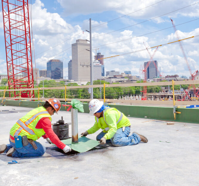 Two men installing a New Roof in Nashville