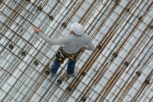unrecognized roofer construction worker in a construction site