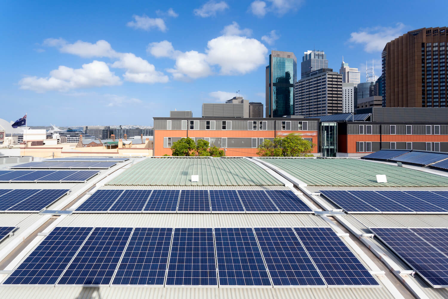 top of eco-friendly building with solar panels installed across the entire roof