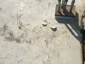 water on commercial roof from a leak