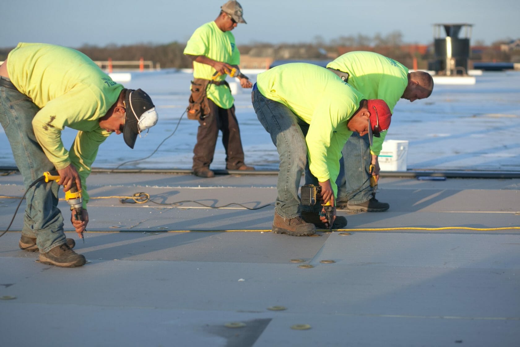 Maxwell Roofing workers repairing a commercial roof