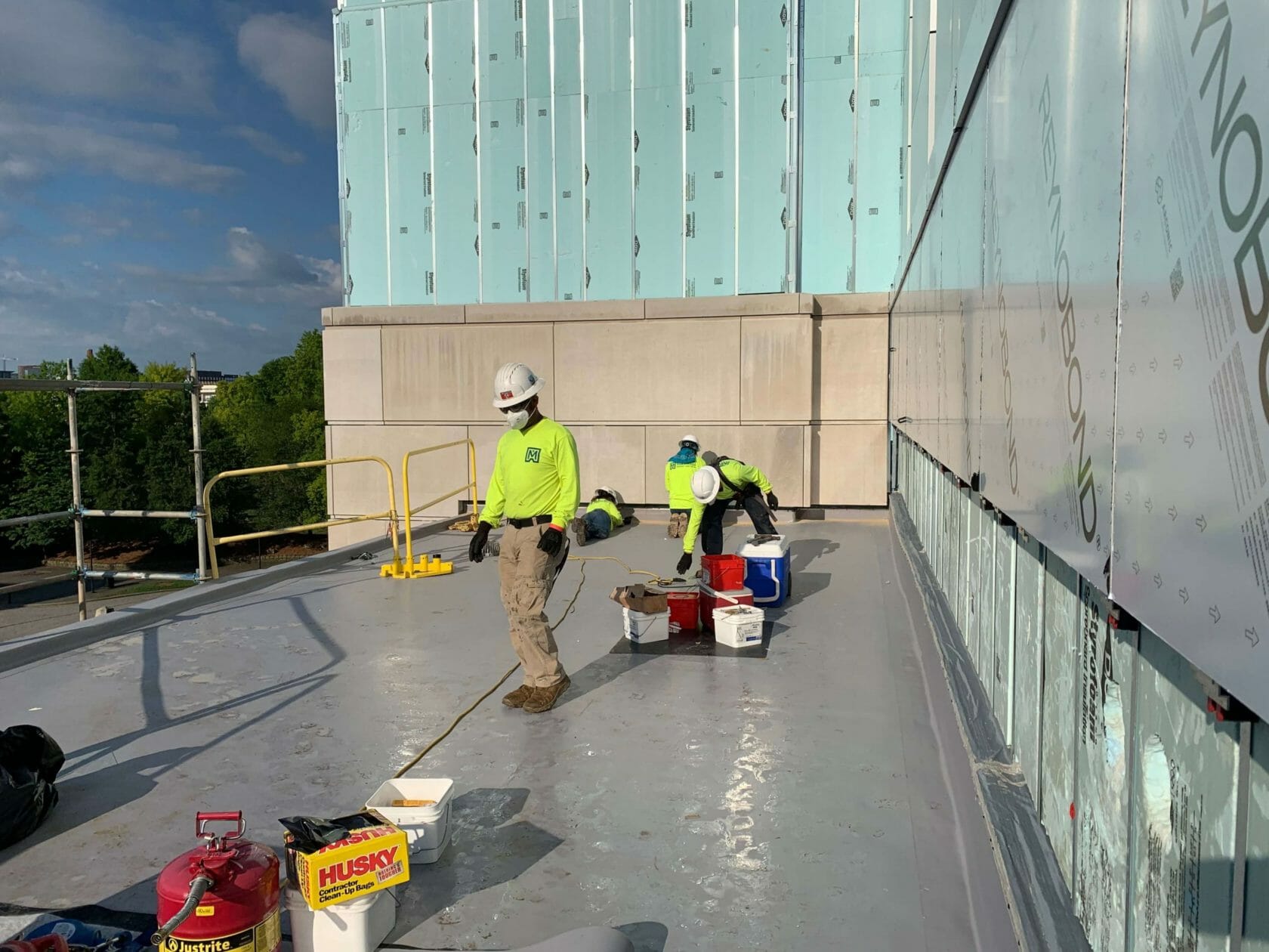 Maxwell monitor service on roof preforming preventative maintenance on a commercial roof