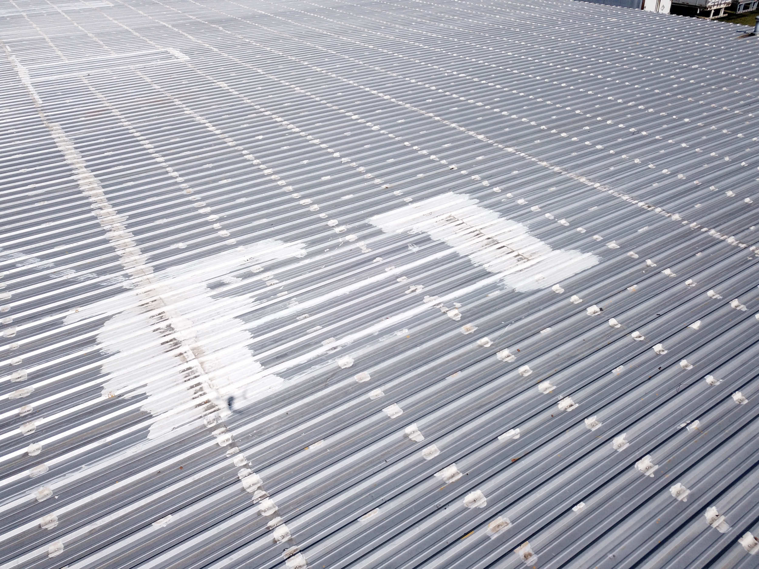 Close up of a roof coating on a commercial roof.