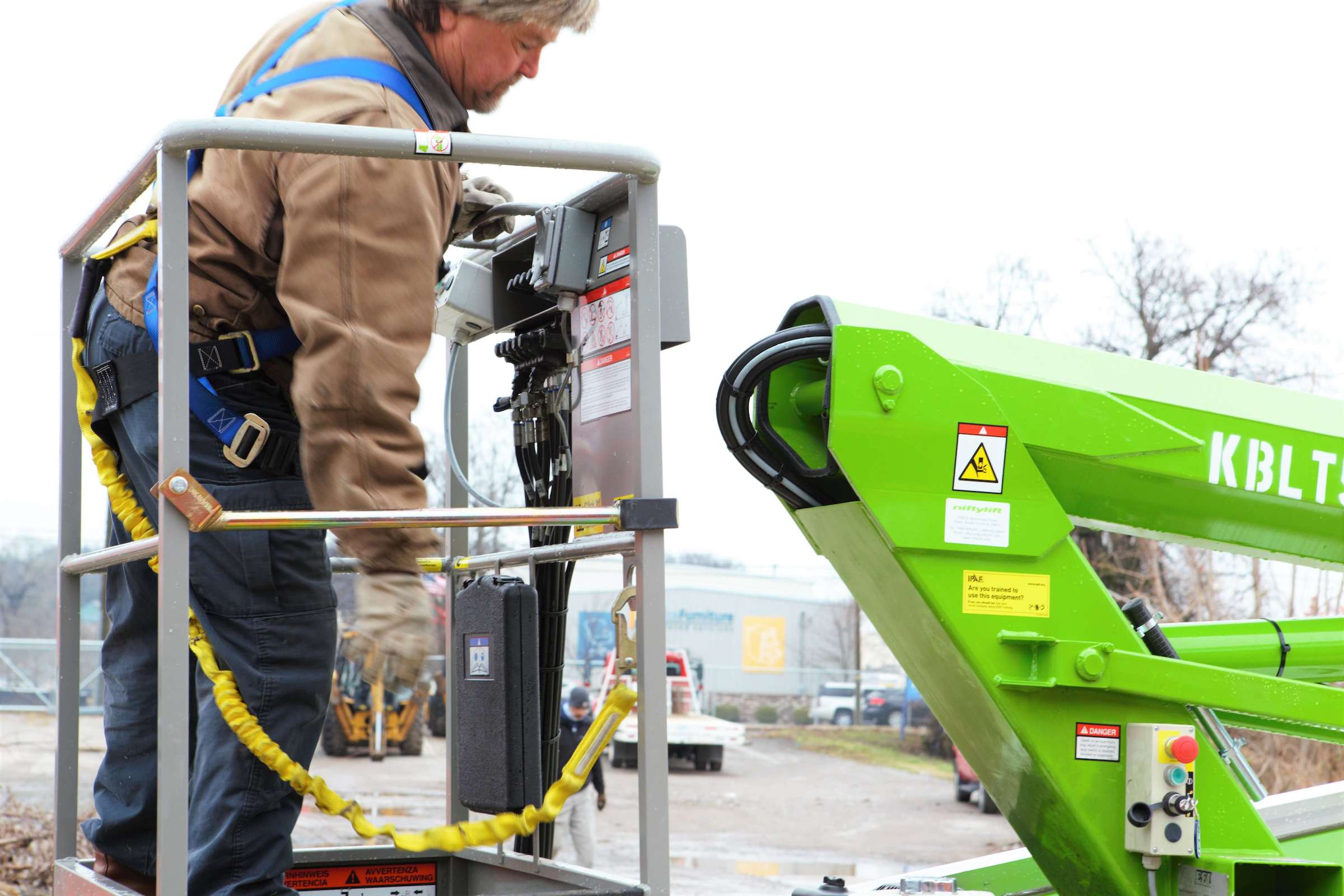 man-in-a-cherry-picker