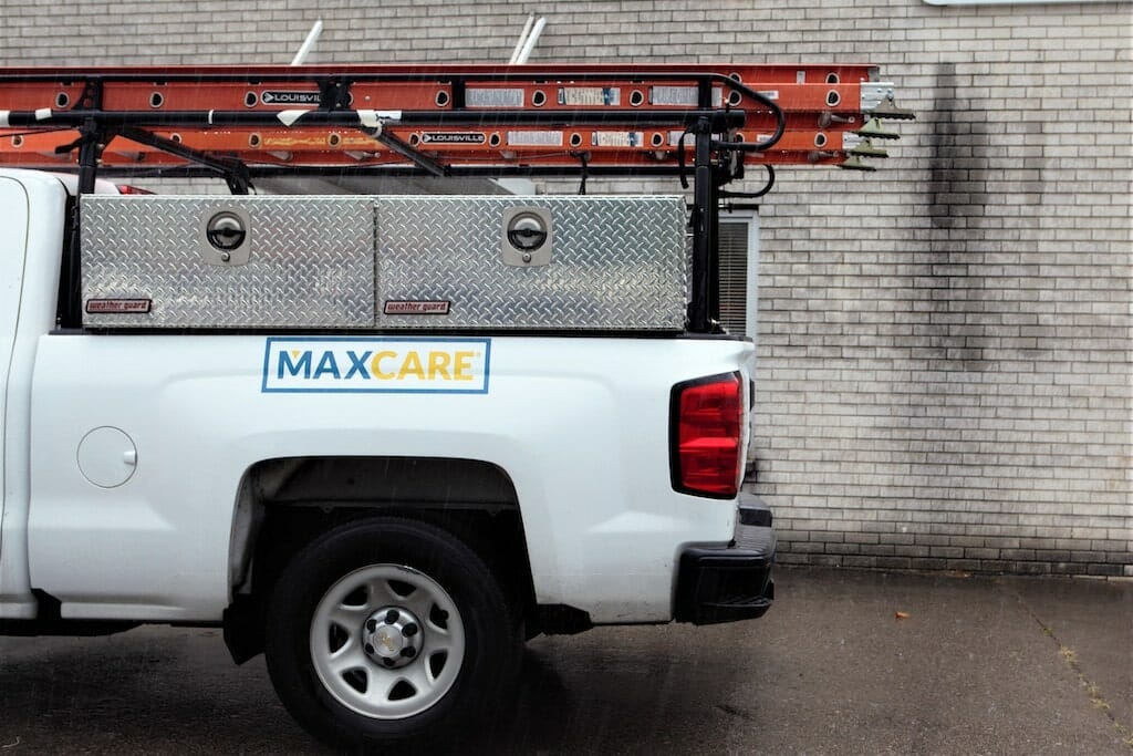 the back half of a maxwell roofing maxcare truck.