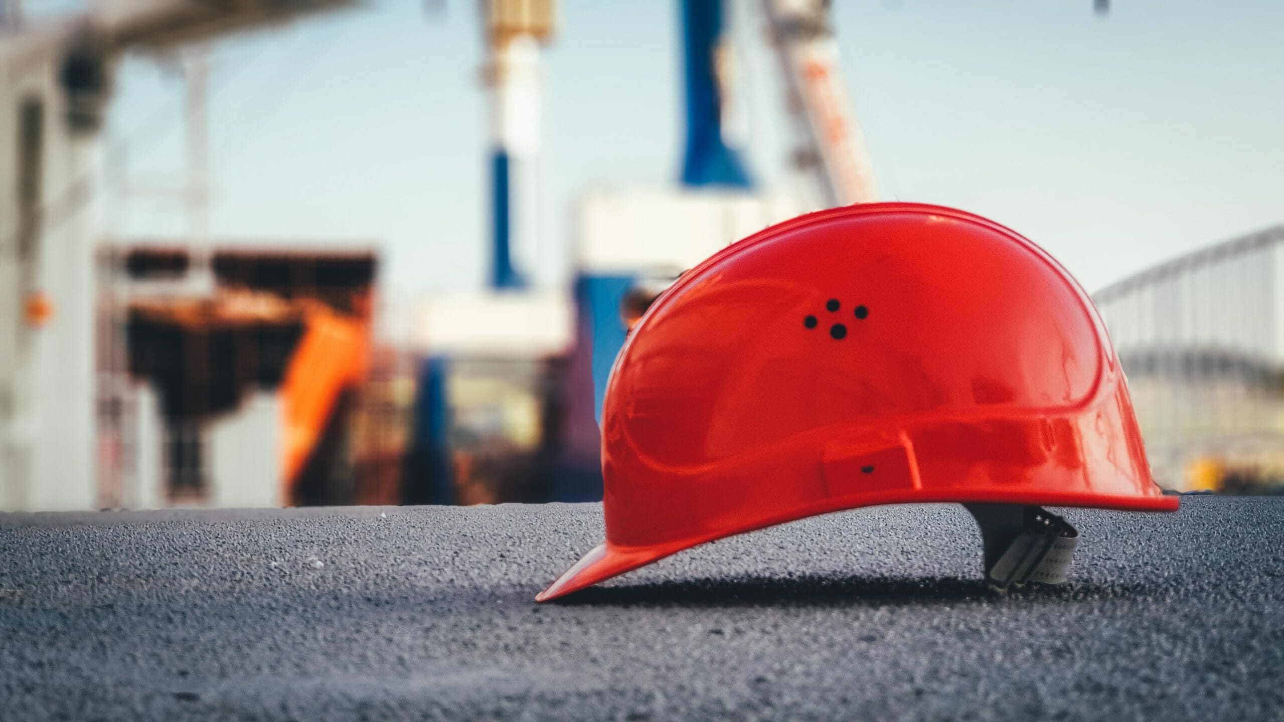 red construction hat on the ground.