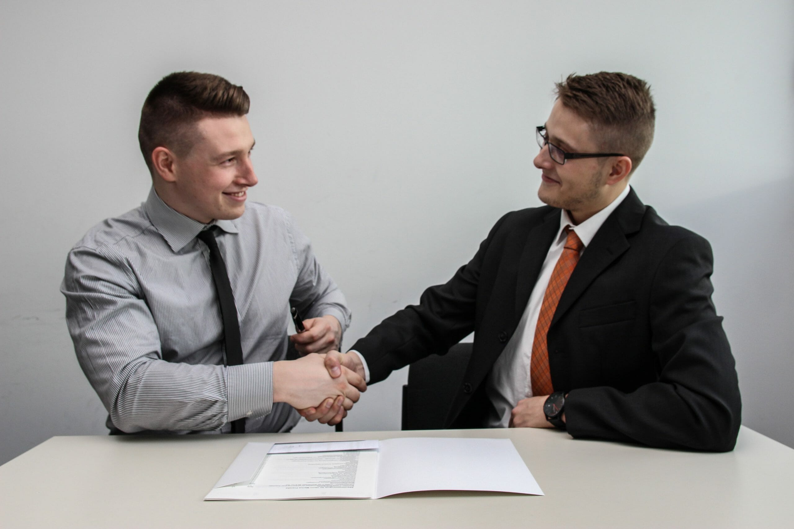 two professionals shaking hands.