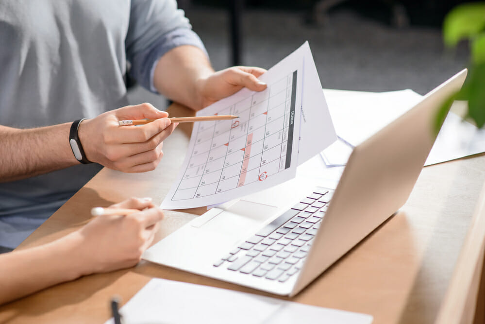 business people working on financial calculations for a roof replacement