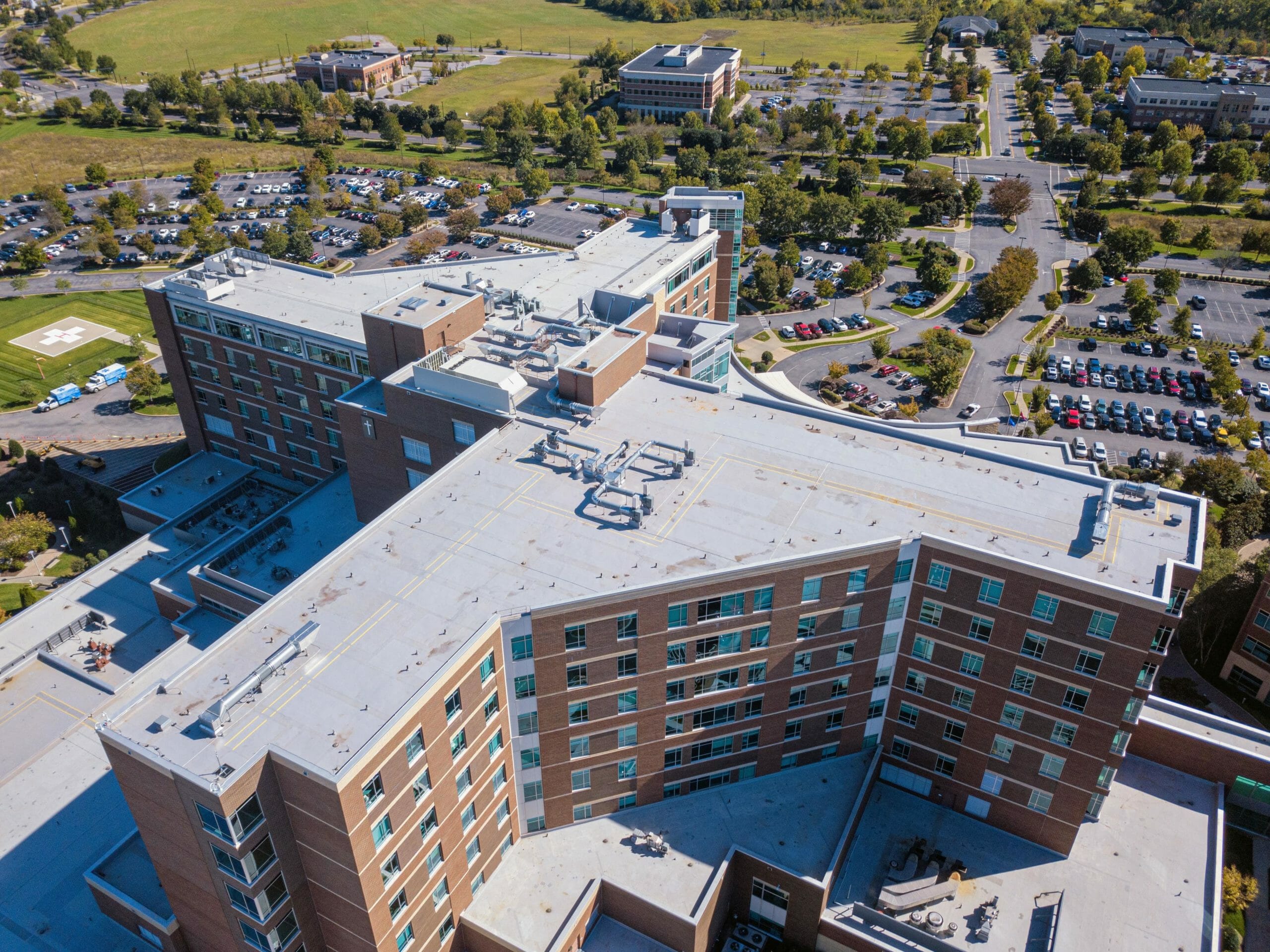 aerial photo of a building featuring the commercial roof.