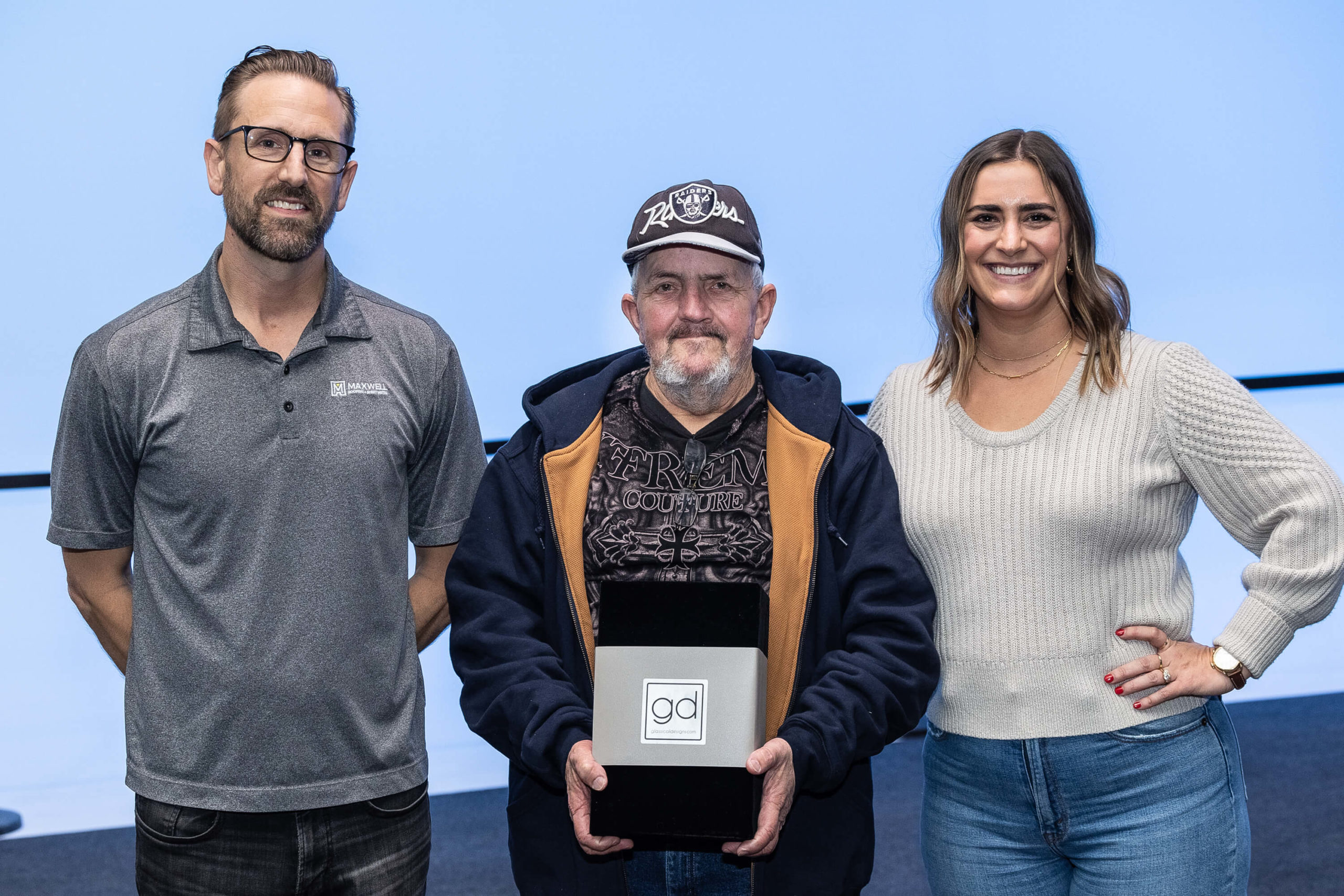 Maxwell Roofing Leadership honoring Ricky Poteete with an award for 25-years of service