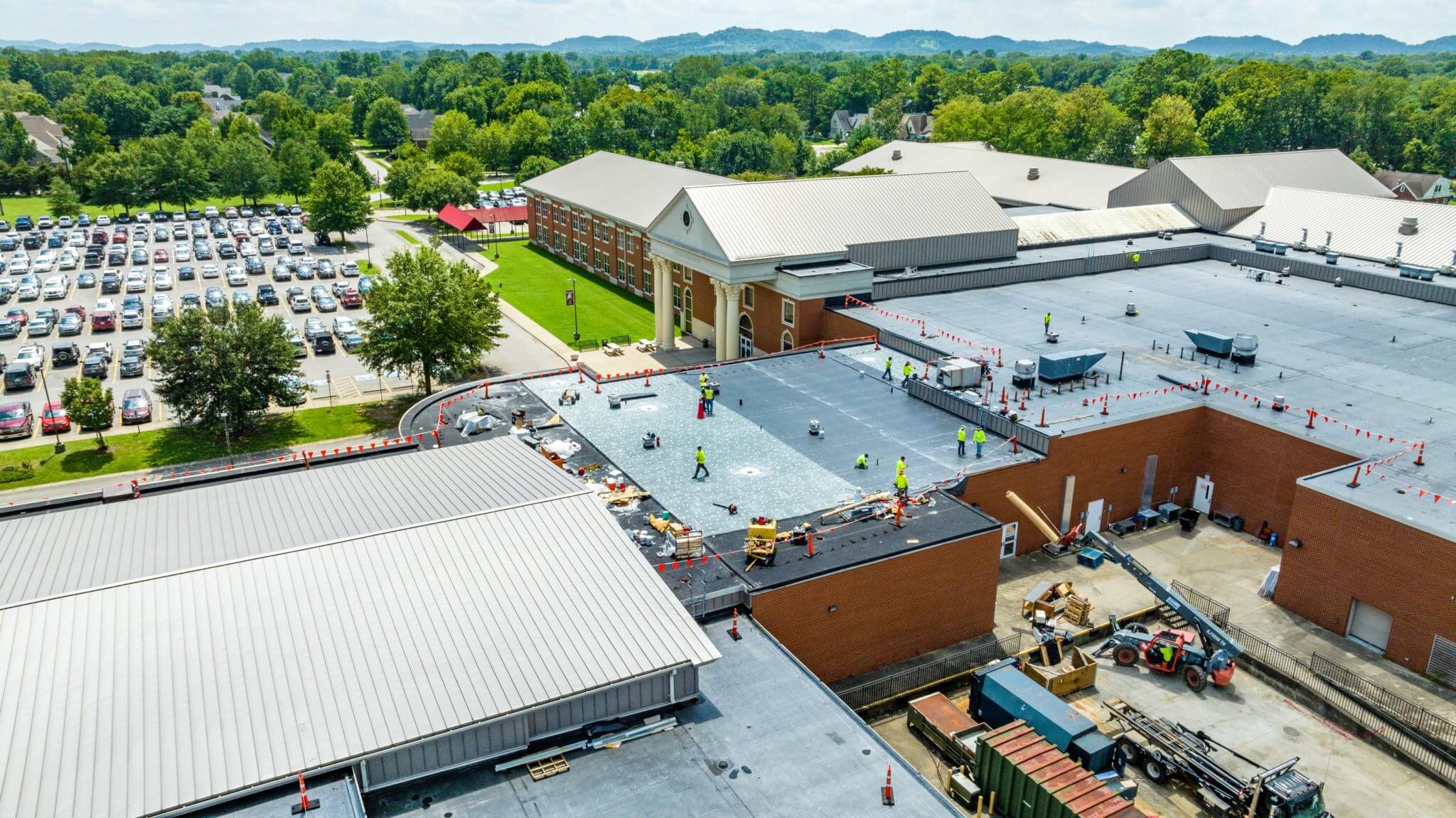 roofing team working on a commercial roof